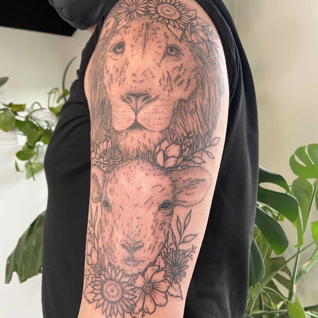 Tattoo of a lion and lamb intertwined with floral designs on a person's upper arm