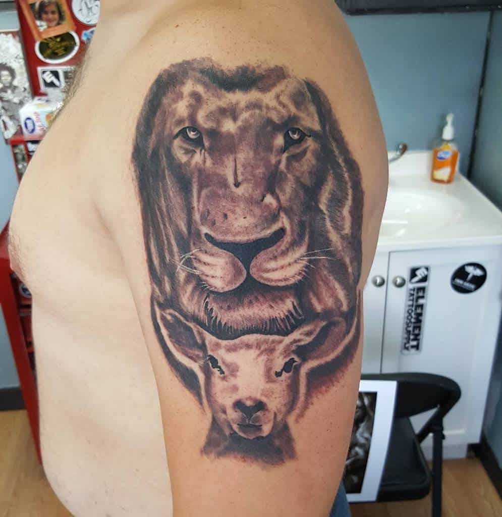 Arm tattoo of a lion's face majestically positioned above a gentle lamb's face on a person's upper arm