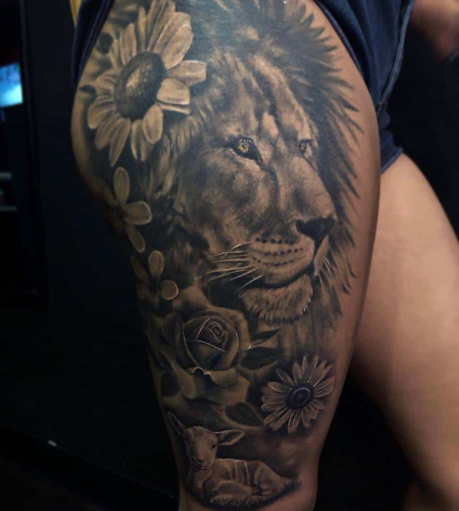 Tattoo of a lion, sunflowers, a rose, and a lamb gracefully adorning a person's thigh