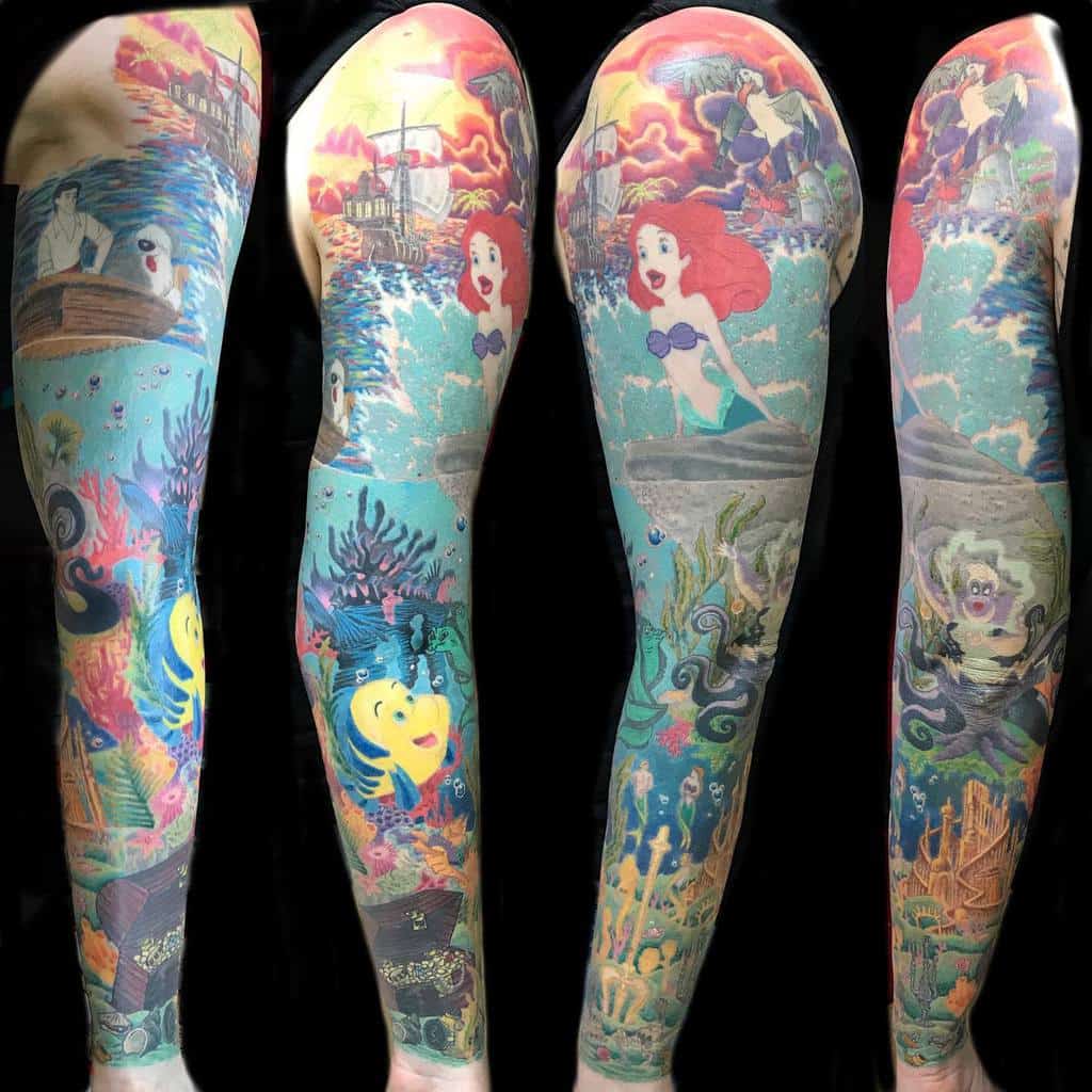 Full sleeve tattoo showcasing a vivid Little Mermaid theme, featuring Ariel, Flounder, Sebastian, Prince Eric, Ursula, Scuttle, and vibrant underwater scenes with coral reefs, sunken treasures, and iconic moments from the movie