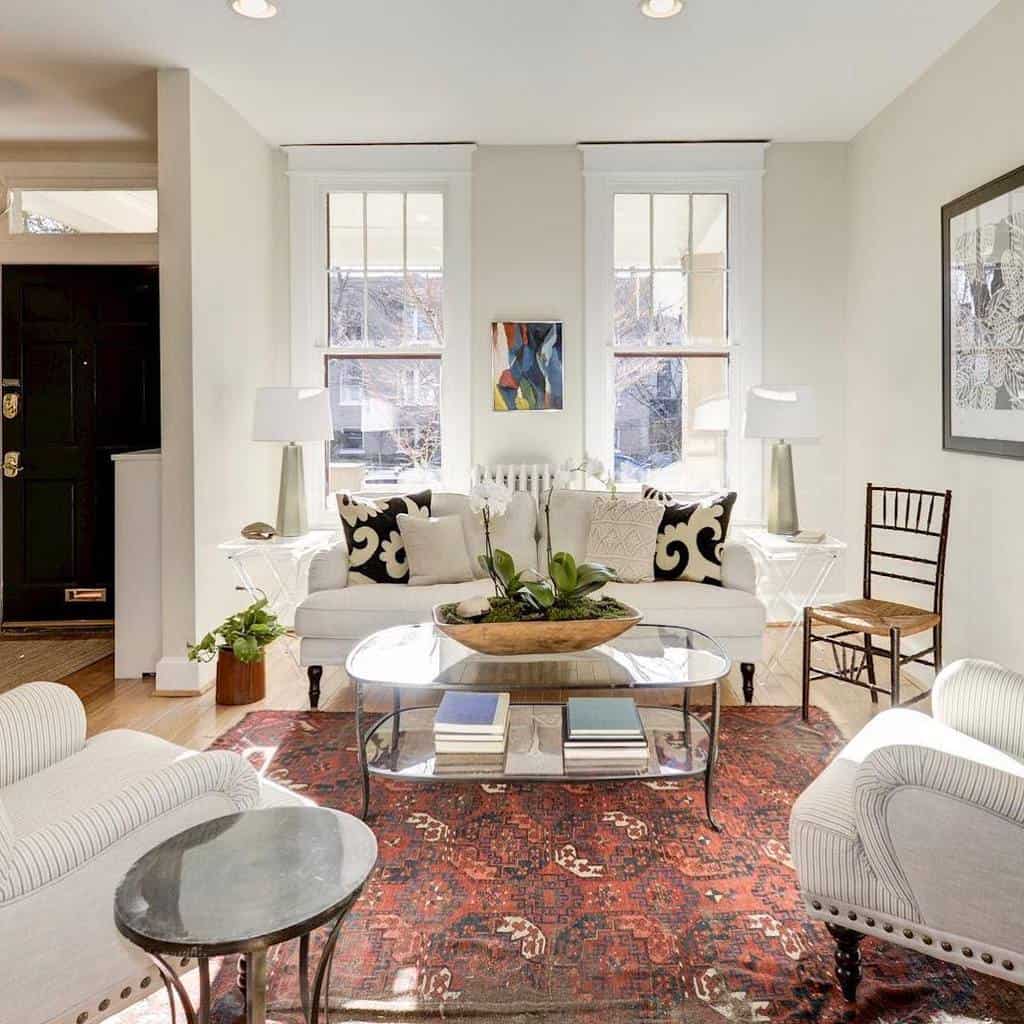 modern living room with white sofas and glass coffee table