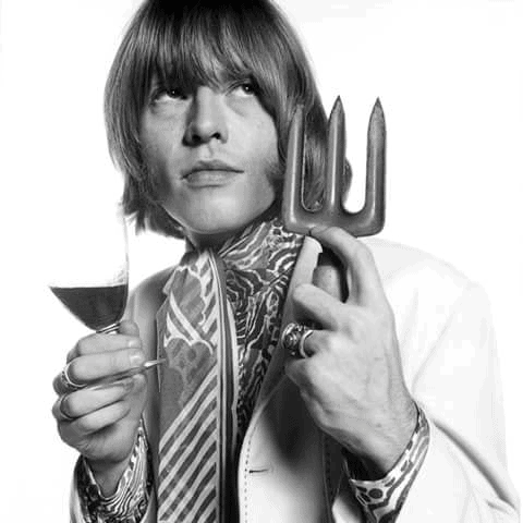 A haircut featuring long straight locks paired with bangs in front covering the whole forehead