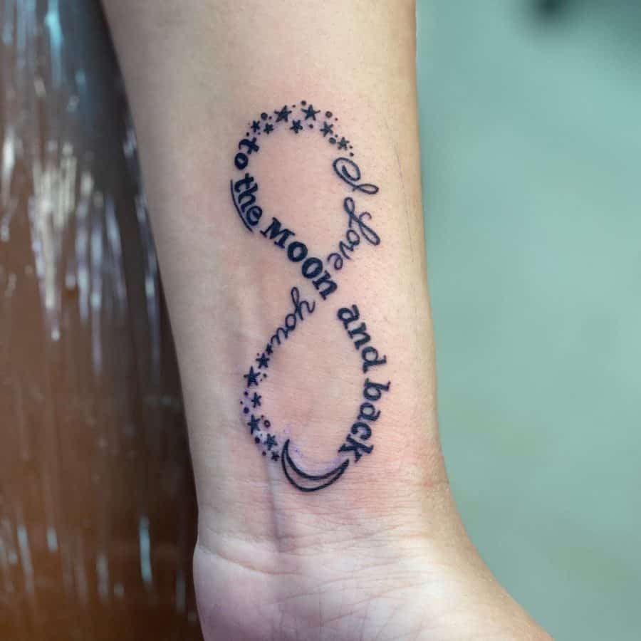 This tattoo features the heartfelt phrase "I love you to the moon and back" within an infinity symbol, accented by stars and a crescent moon. It beautifully represents eternal love and the vastness of affection.