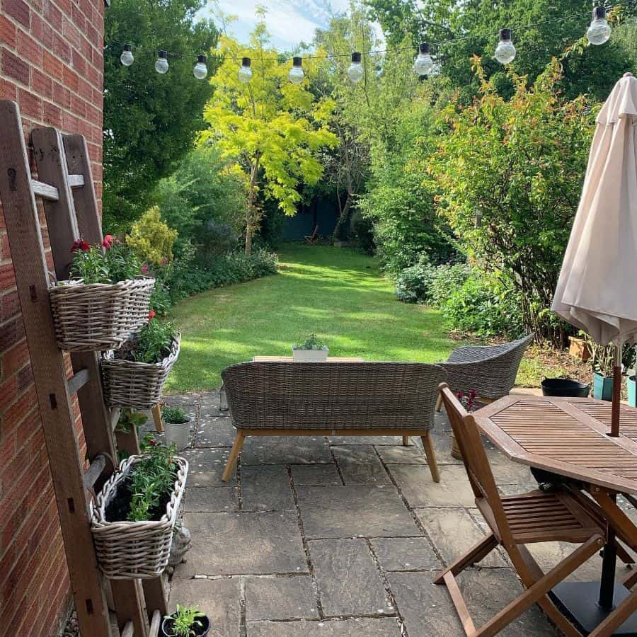 stone paver patio with wicker furniture 