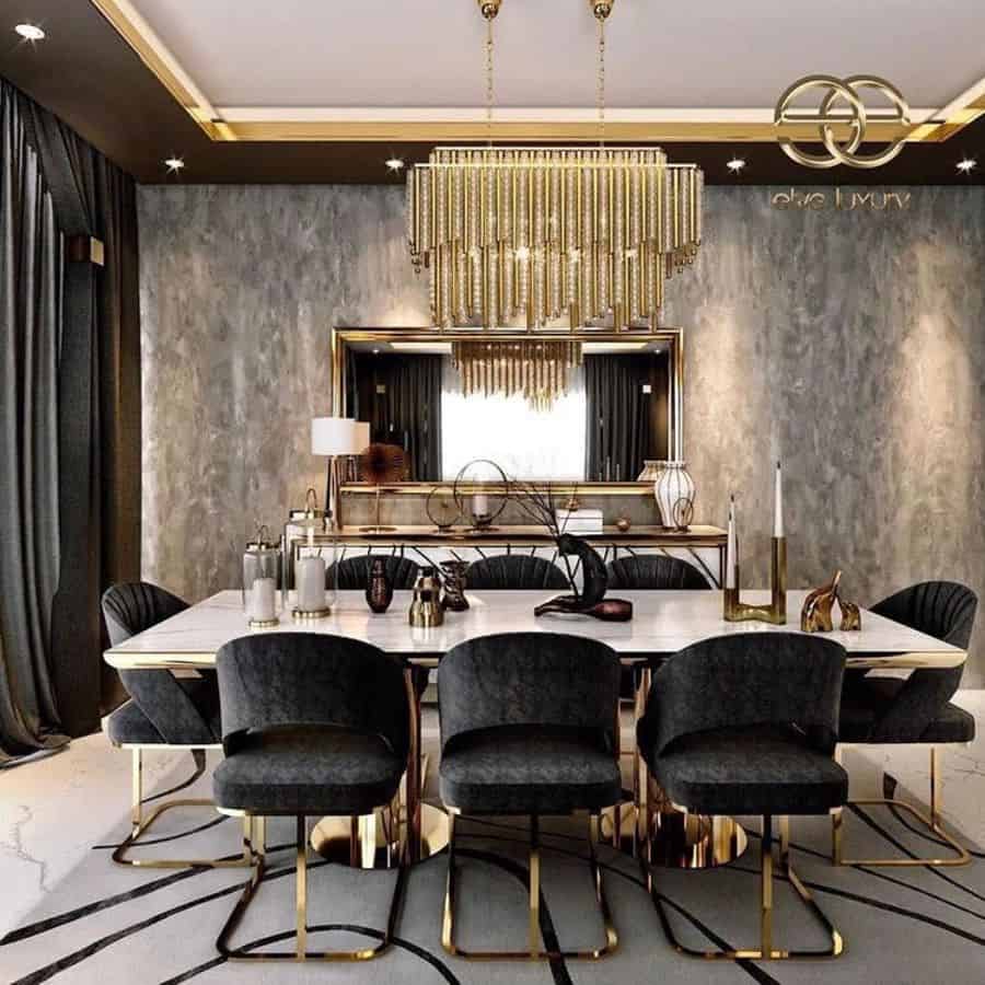 luxury dining room marble table black seats gray feature wall large gold chandelier wall mirror
