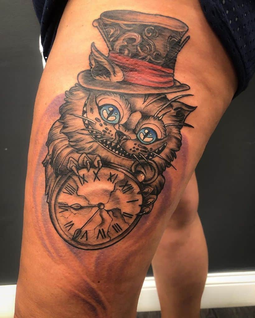 A detailed Cheshire Cat tattoo wearing a Mad Hatter hat, holding a cracked clock with its claws, set against a swirling background