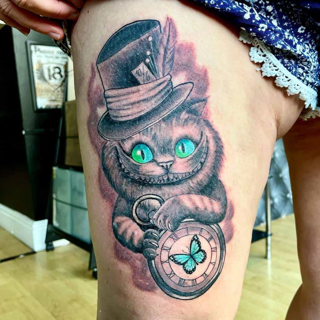 A tattoo of the Cheshire Cat with glowing green eyes, wearing a Mad Hatter hat and holding a pocket watch with a butterfly