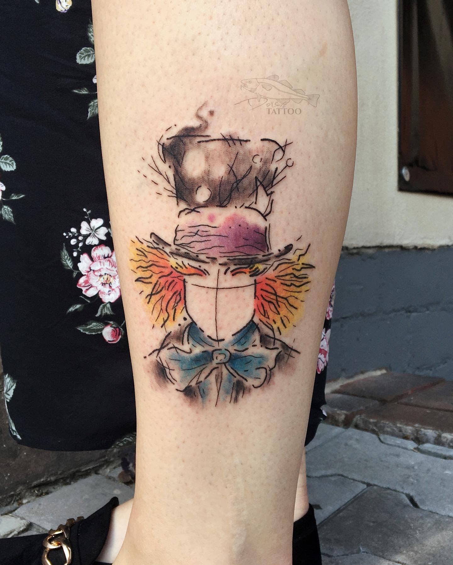 Abstract watercolor tattoo of the Mad Hatter, featuring bold colors and sketchy lines, capturing his eccentric essence