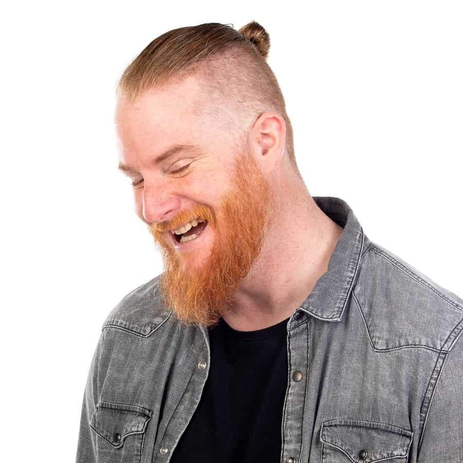 Man Bun Paired With Fade And Thick Beard