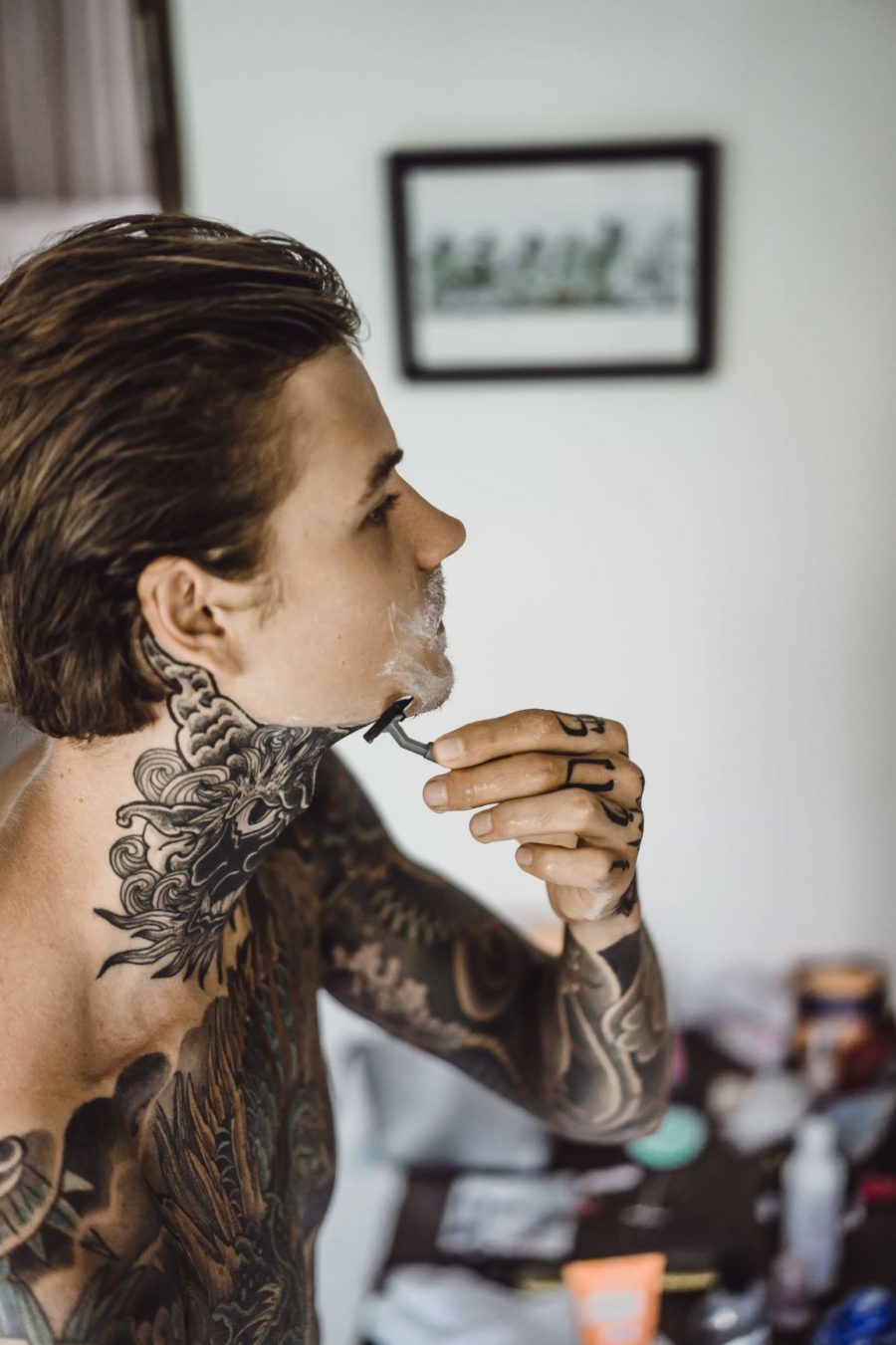 Man Shaving Tattooed Skin