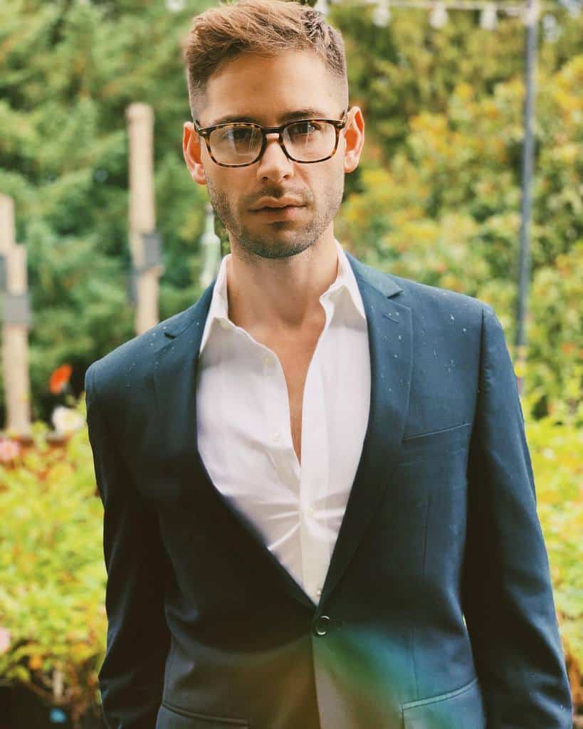 Man Wearing Suit And Glasses