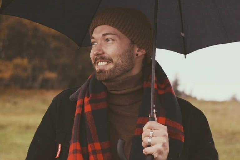 Man With Scarf And Umbrella In Fall Weather