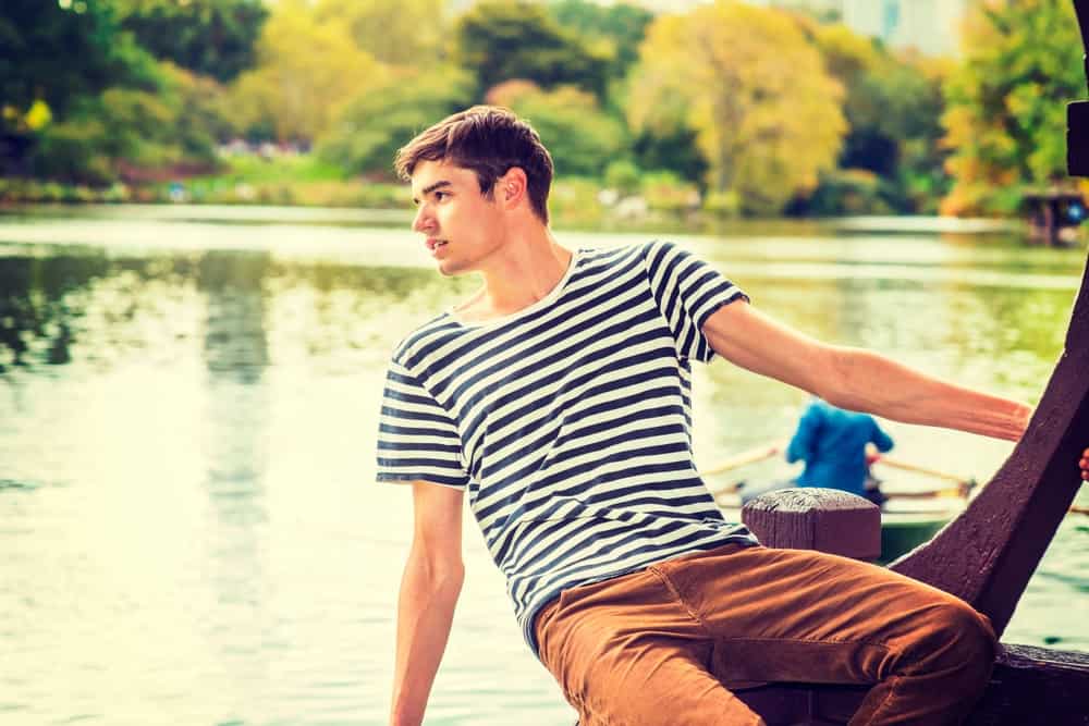 Man In Boat Wearing Corduroy Pants