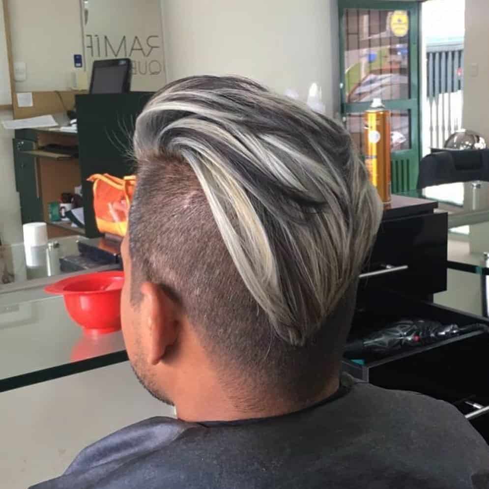 Man Wearing Silver Slicked Back Cut With An Undercut