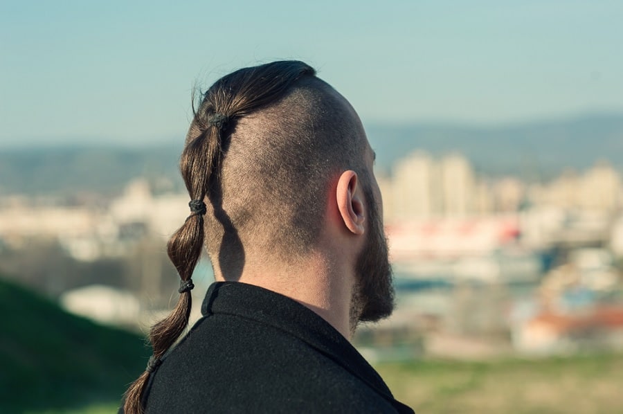 Man With Viking Haircut Shaved Head and Ponytail