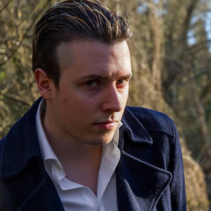 Man with brown hair and blond highlights