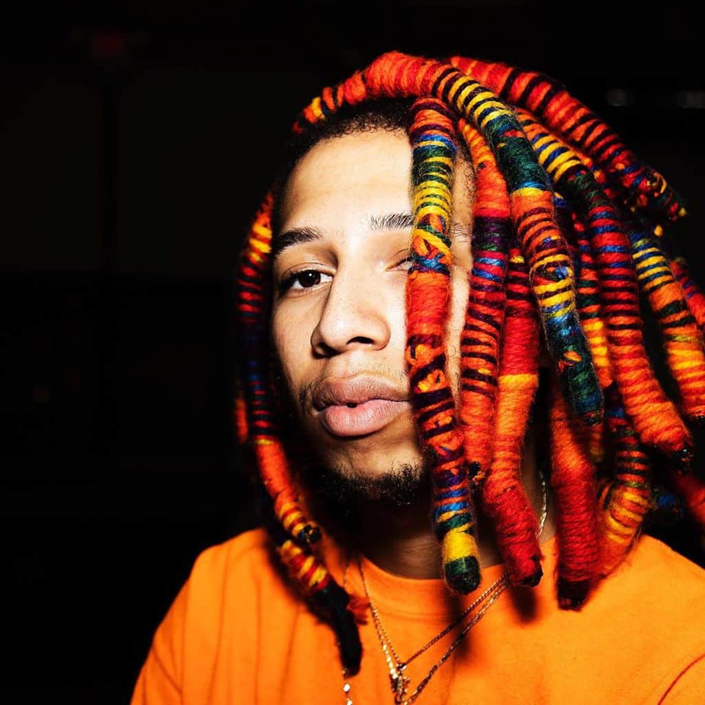 Man With Dreadlocks With Yarn Wraps Of Different Shades