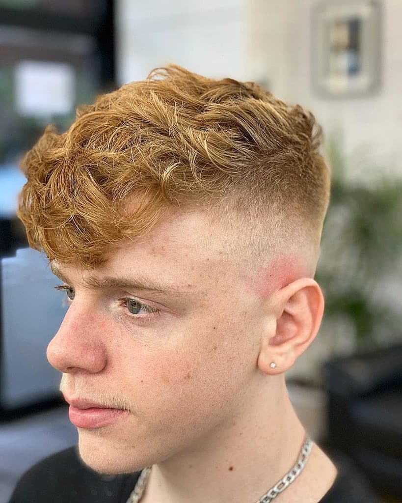 Man with red hair and blond highlights-hair_and_comb