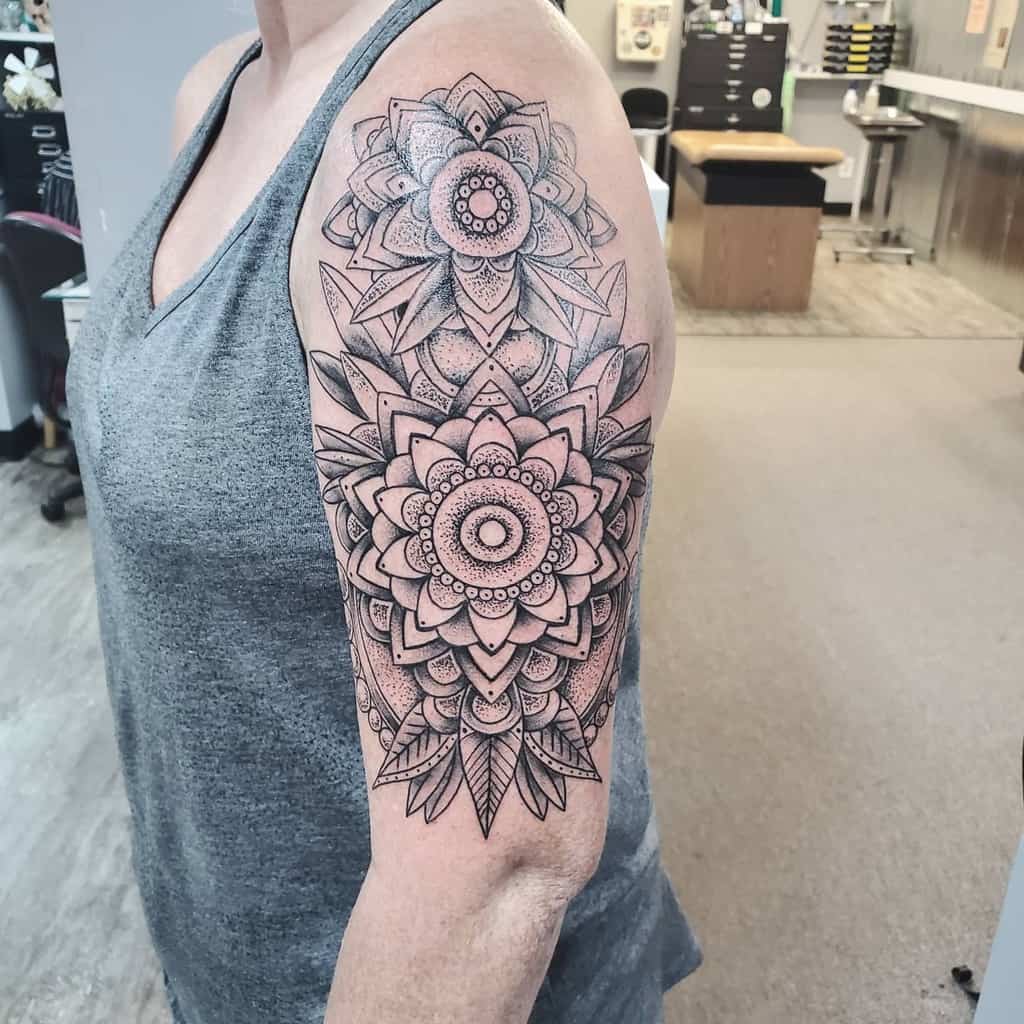 Woman with a mandala tattoo on her upper arm