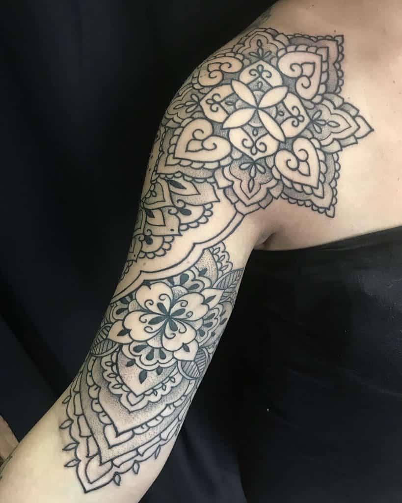 Intricate mandala tattoo covering shoulder and upper arm