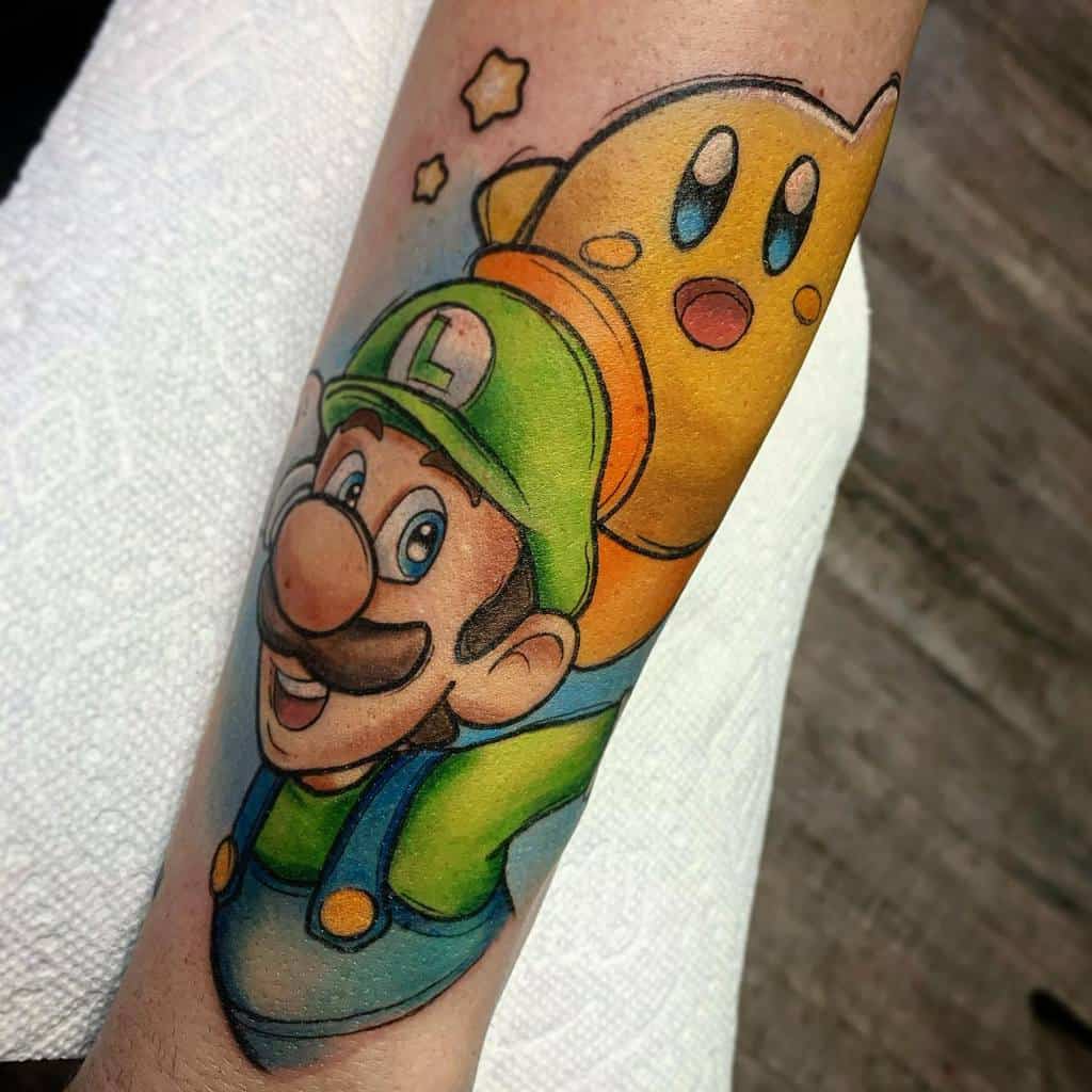 Tattoo of Luigi from Super Mario smiling with a yellow Kirby floating behind him, with two stars and blue background