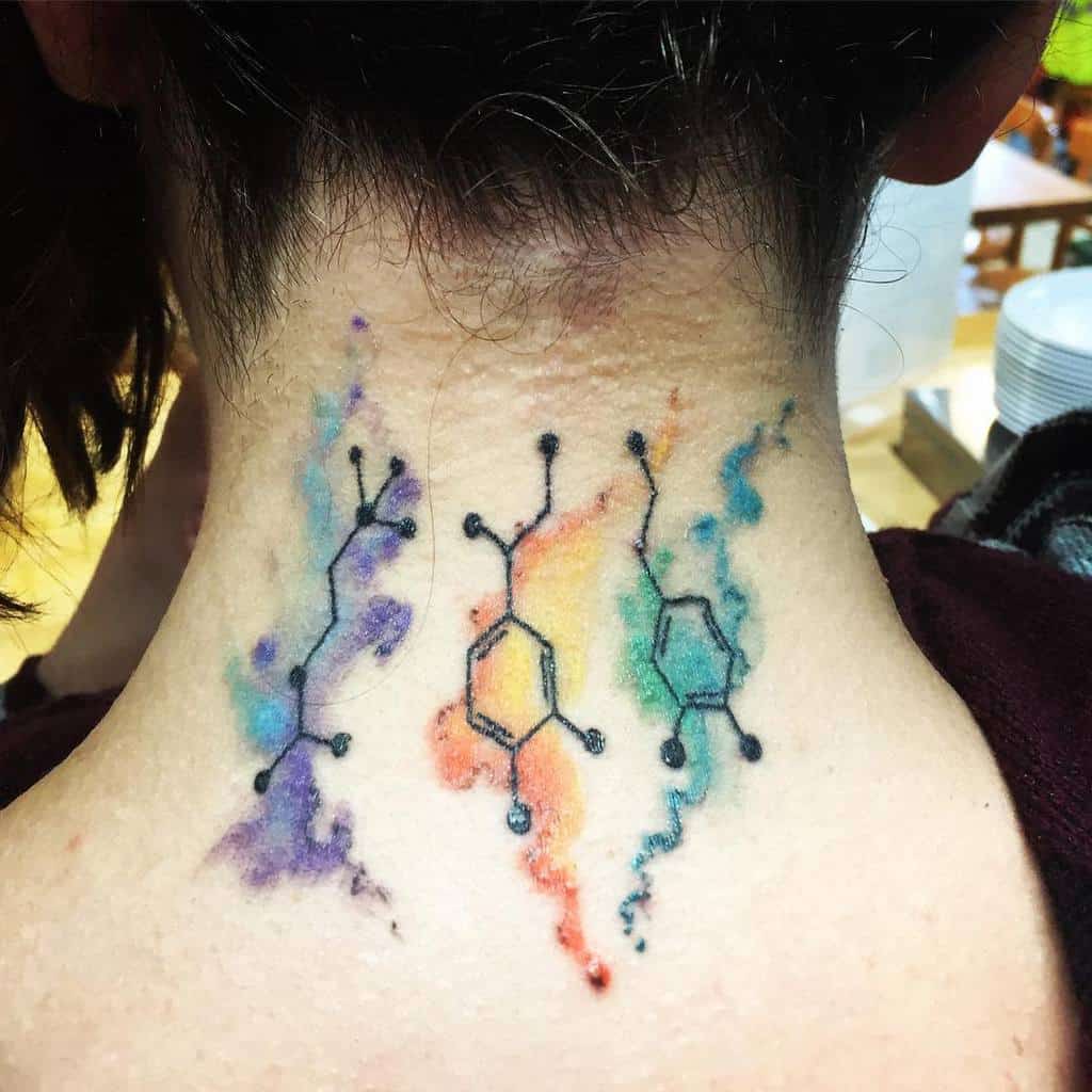 Molecule tattoos with colorful splashes on the back of neck