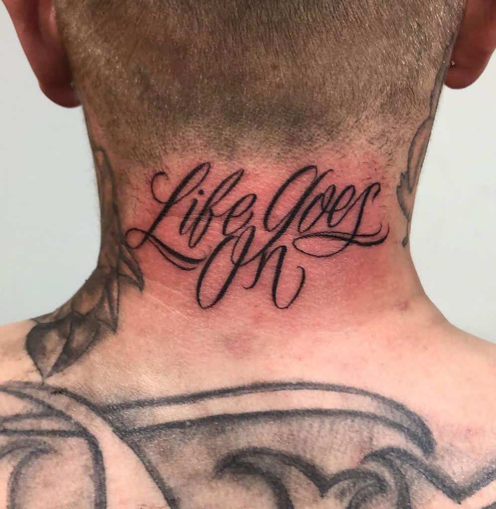 Life Goes On tattoo in elegant cursive script on back of neck