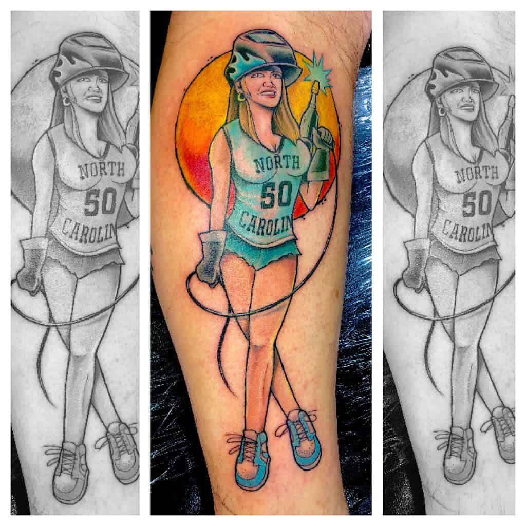 Tattoo of a woman in a helmet and tank top with "North Carolina" and "50" holding a burning bottle