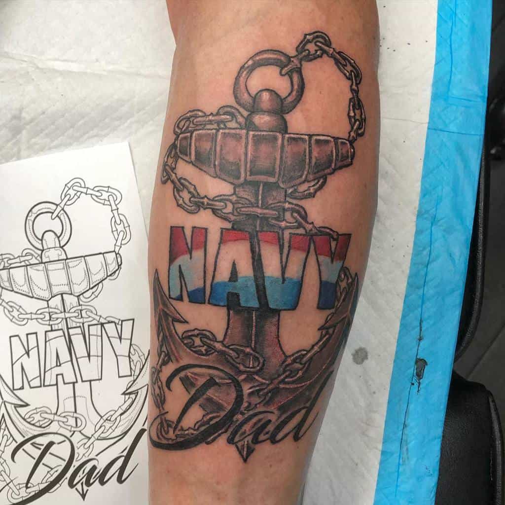 Tattoo of an anchor with "NAVY" in red, white, and blue, and "Dad" written below