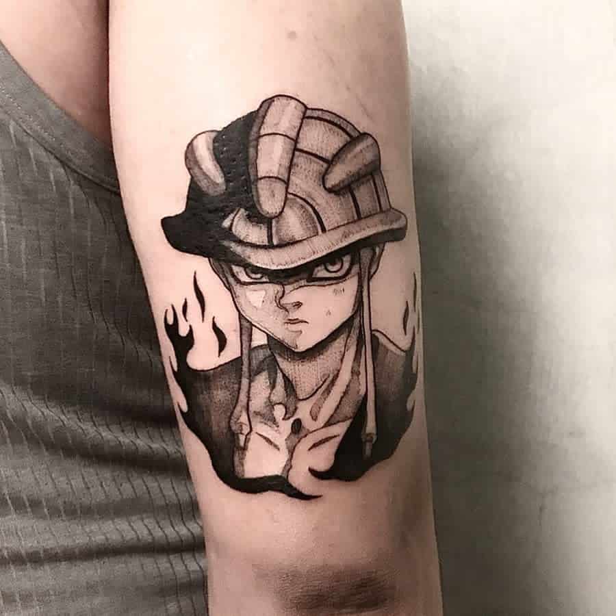 Black and gray tattoo of Meruem from Hunter X Hunter, with a fiery effect around him, on a person's upper arm