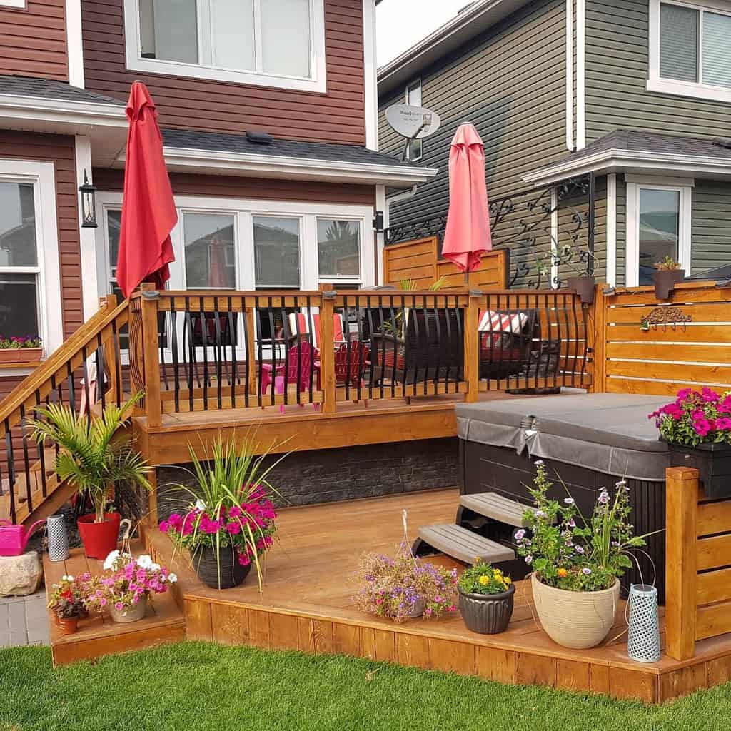 wood deck metal fence red umbrellas
