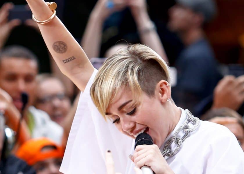 Miley Cyrus Performing Shows Right Forearm Tattoo