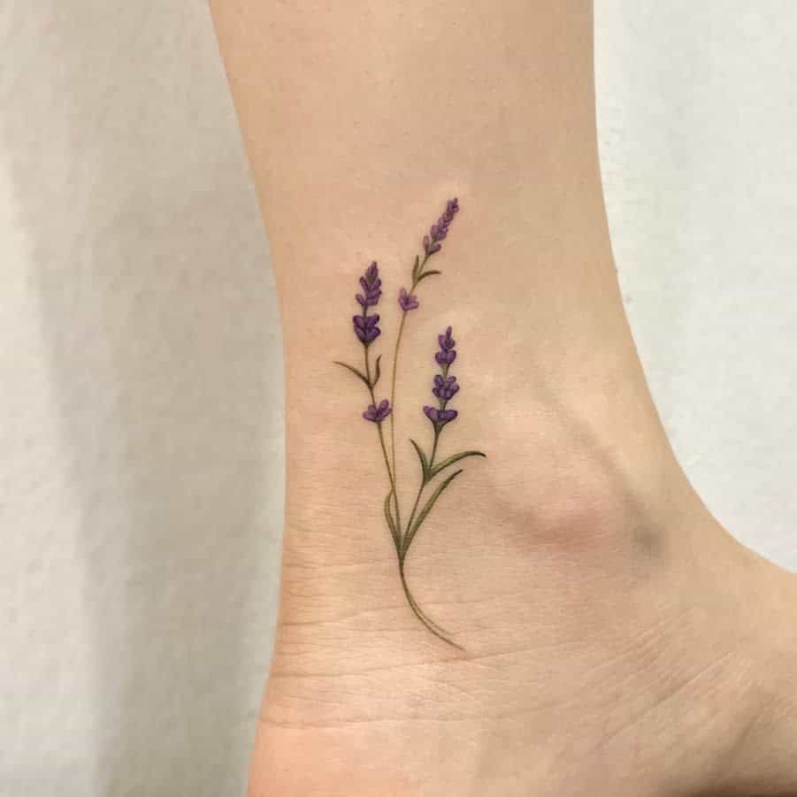 Small lavender tattoo on the inside of an ankle