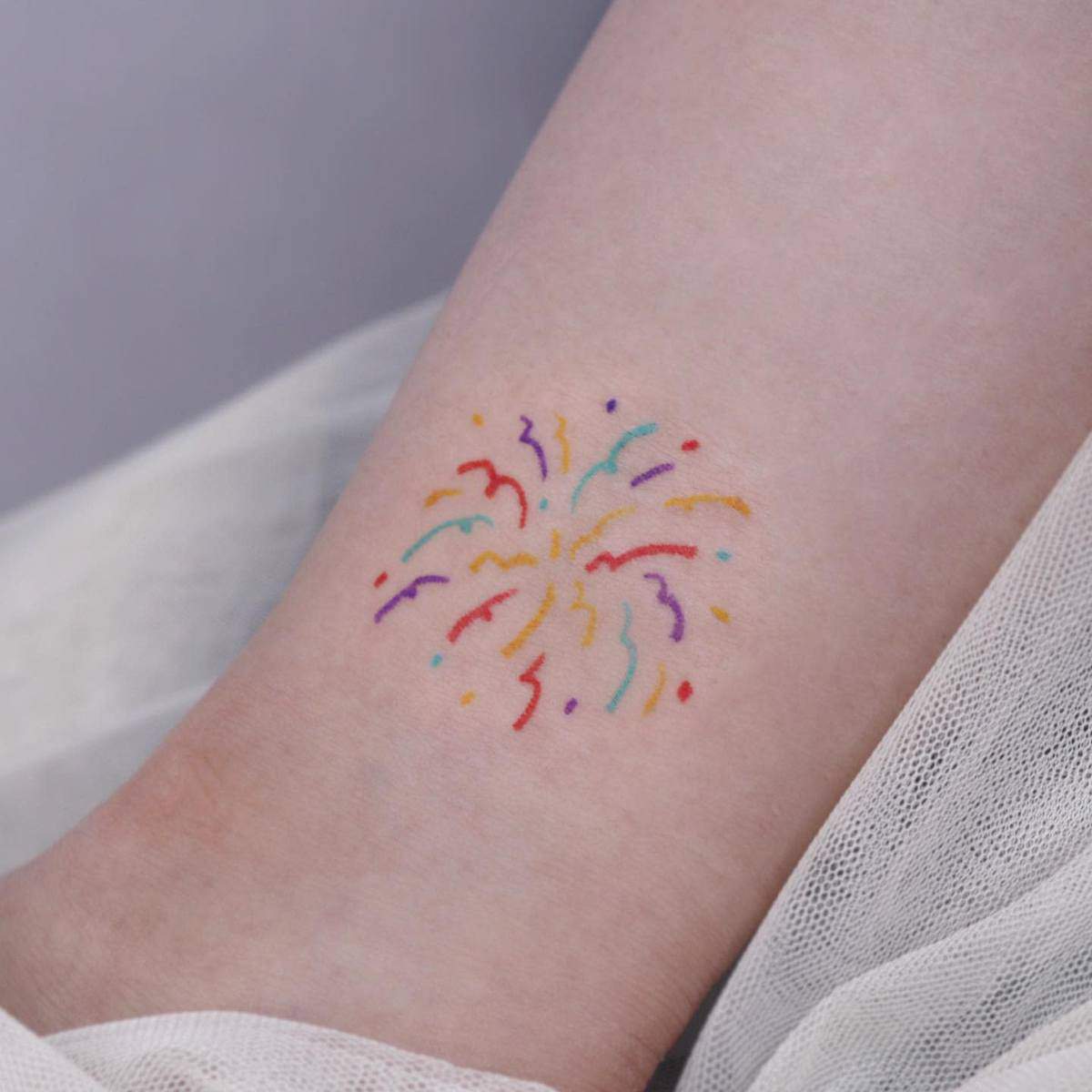 Colorful fireworks tattoo design on the ankle with multiple lines in different colors