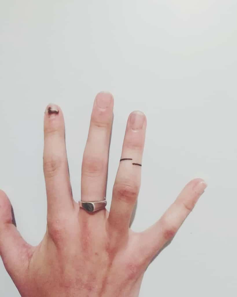 A minimalist black ink ring tattoo of two simple lines