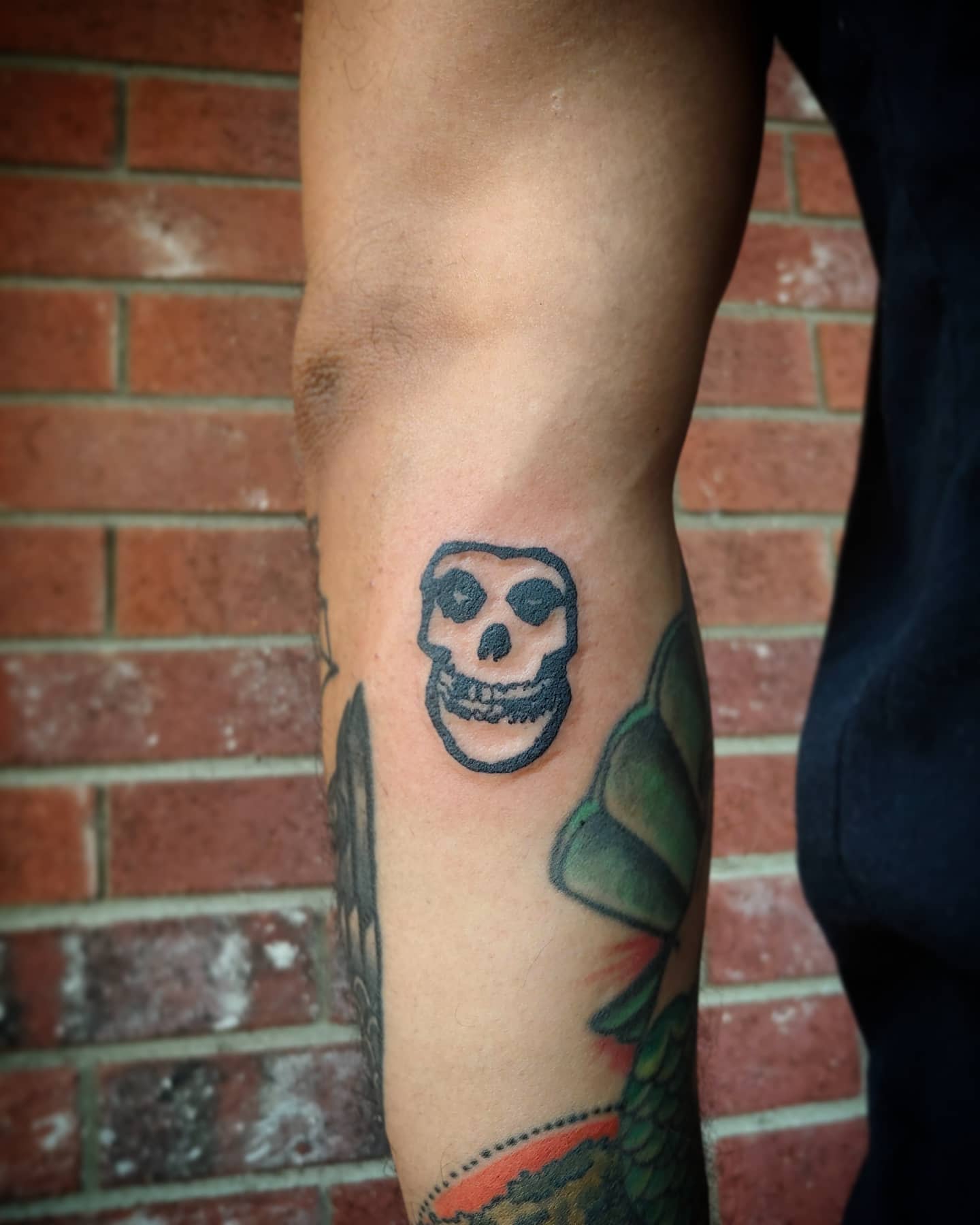 Tattoo of a skull on an arm