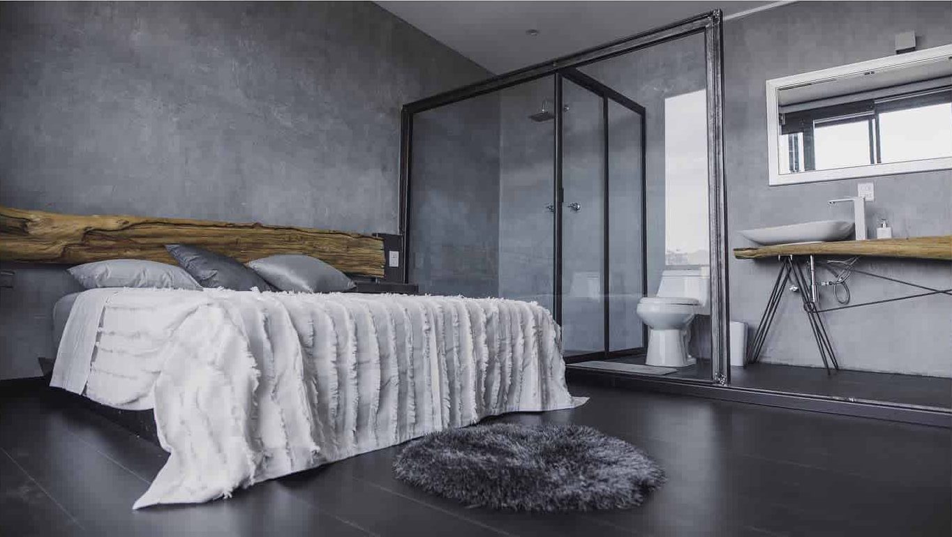 modern minimalist concrete bedroom with ensuite