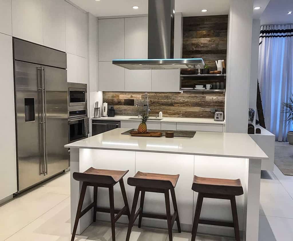 modern white kitchen wood panel backsplash three stools pineapple