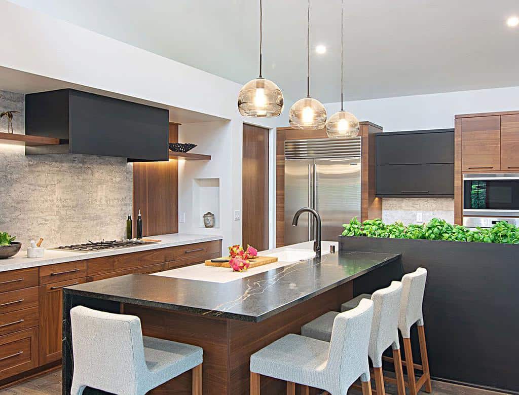 modern kitchen with stained wood cabinets black marble countertop four white chairs