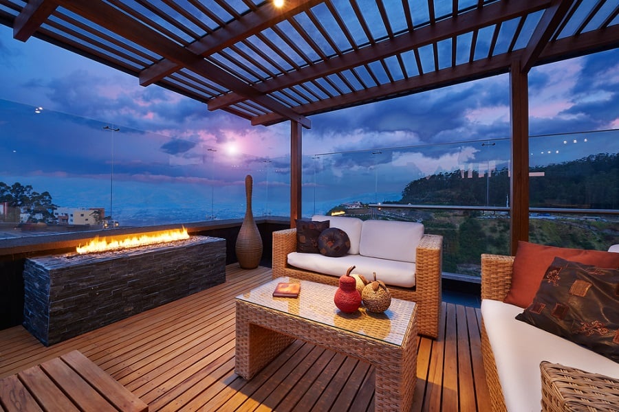 modern patio with fireplace and ocean view
