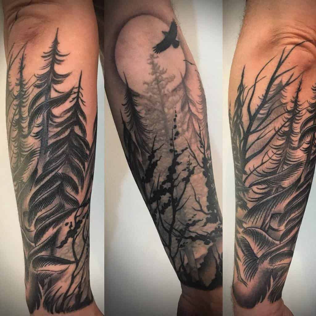 Forearm tattoos featuring forest scenes with trees and a bird in flight