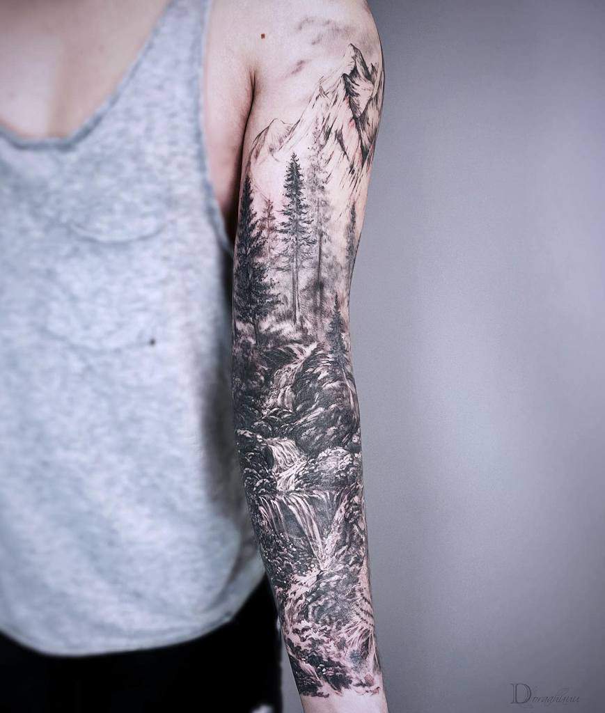 Full sleeve tattoo with mountain, trees, and waterfall design