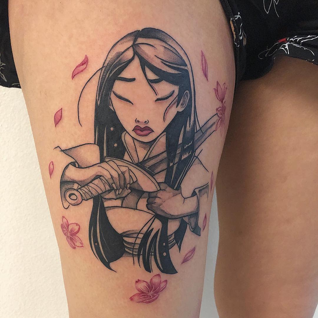 Tattoo of Mulan with a sword surrounded by pink flowers on a thigh