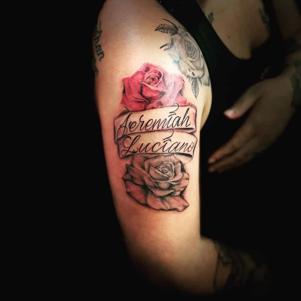 Tattoo of two roses and the name "Jeremiah Luciano" on an upper arm