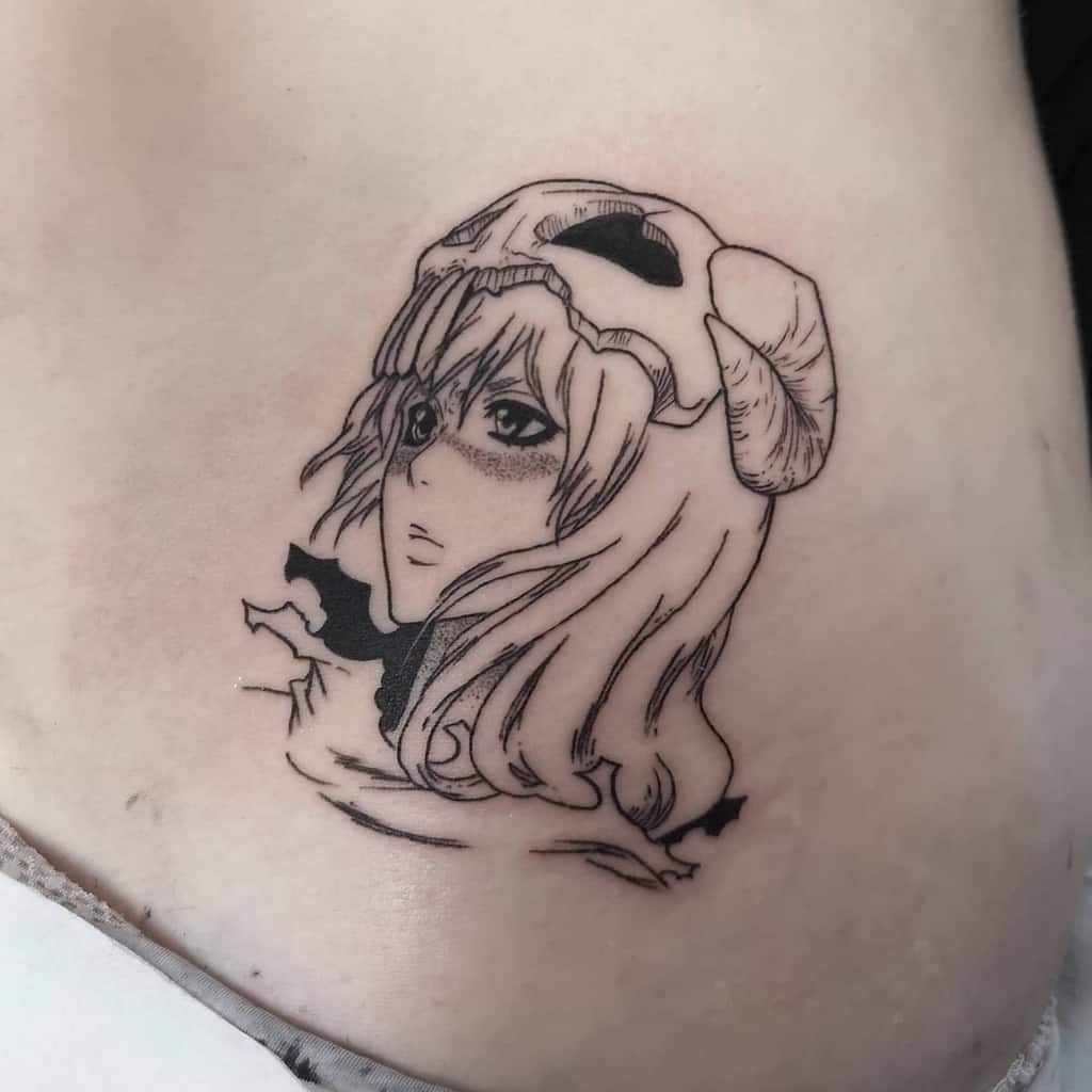 Black ink tattoo of Nelliel Tu Odelschwanck from Bleach, featuring her ram skull Hollow mask, long flowing hair, and delicate shading