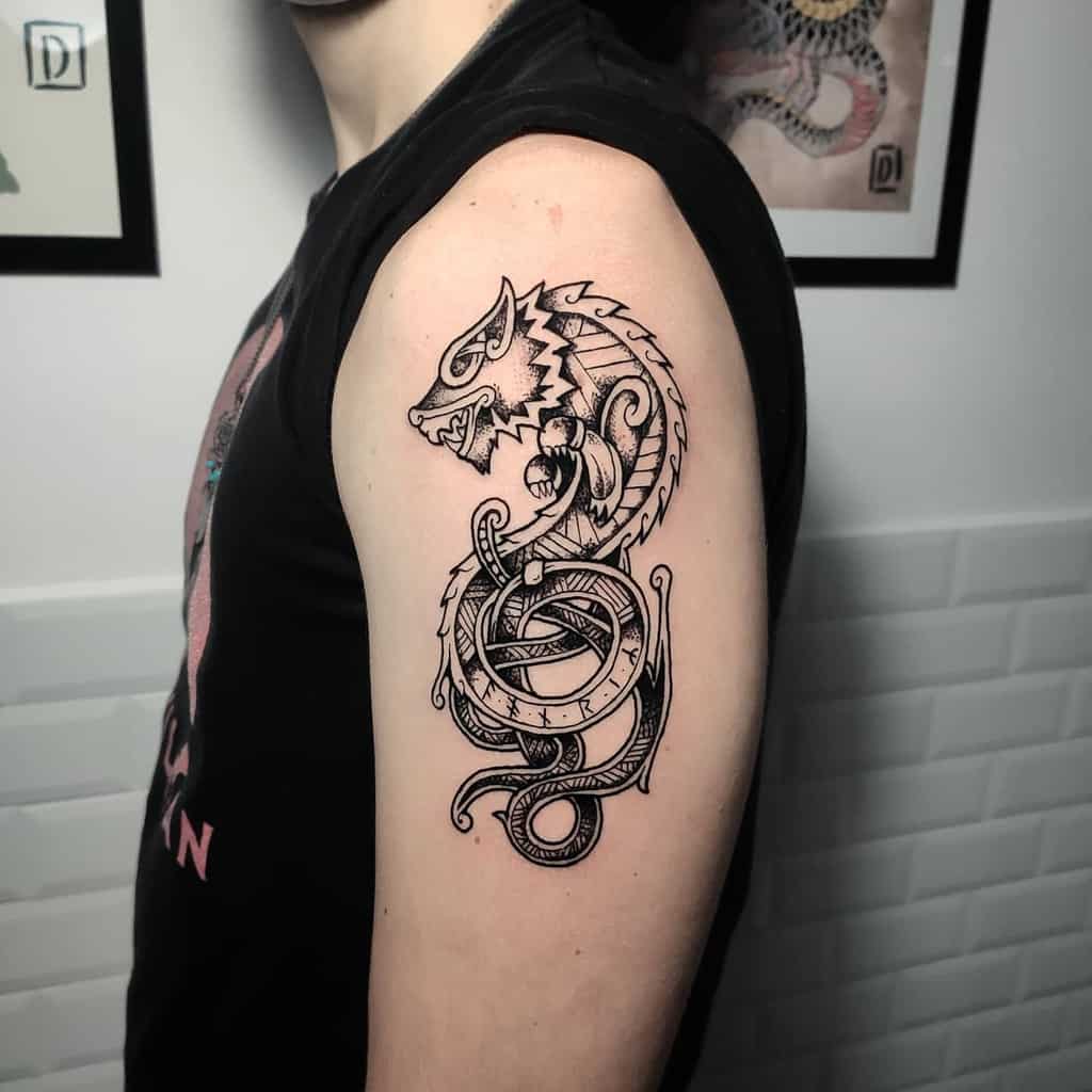 A black ink tattoo featuring the mythological wolf Fenrir, intertwined with a Viking-inspired clock and serpent