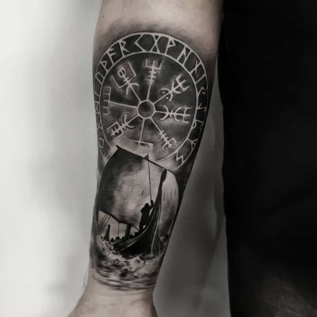 A Nordic forearm tattoo featuring a Viking ship sailing through waves, with the Vegvisir symbol above, surrounded by runes