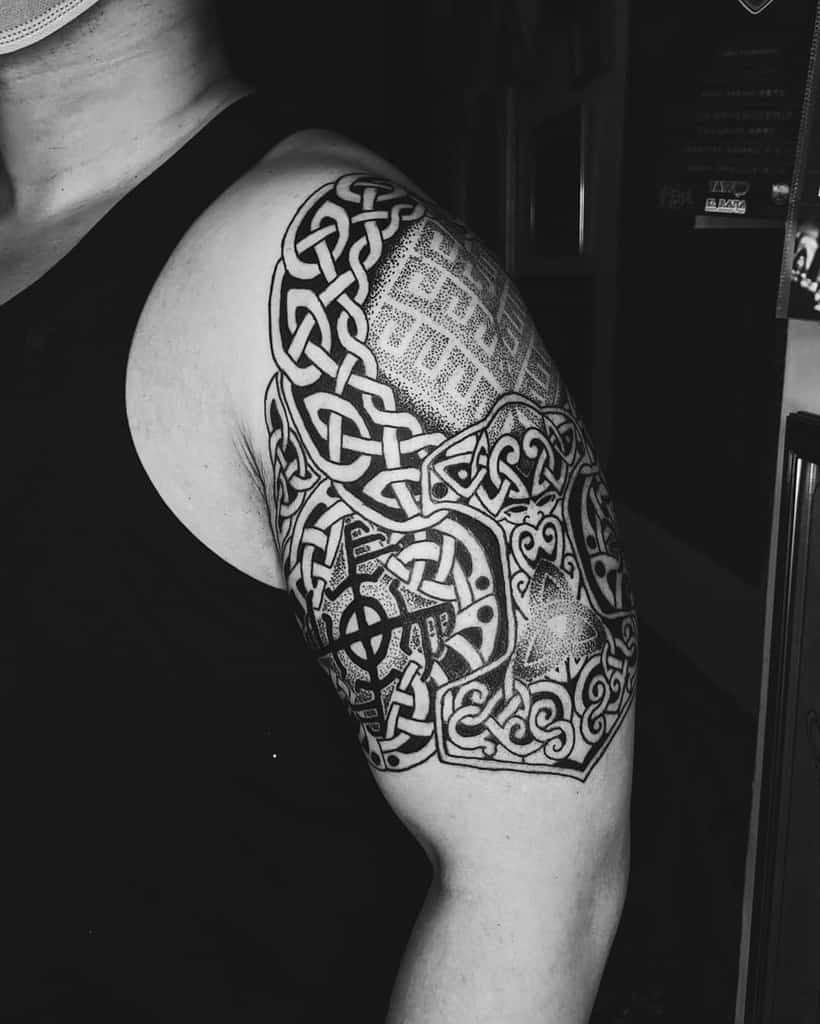 Celtic-inspired Nordic shoulder tattoo featuring intricate knotwork and geometric patterns