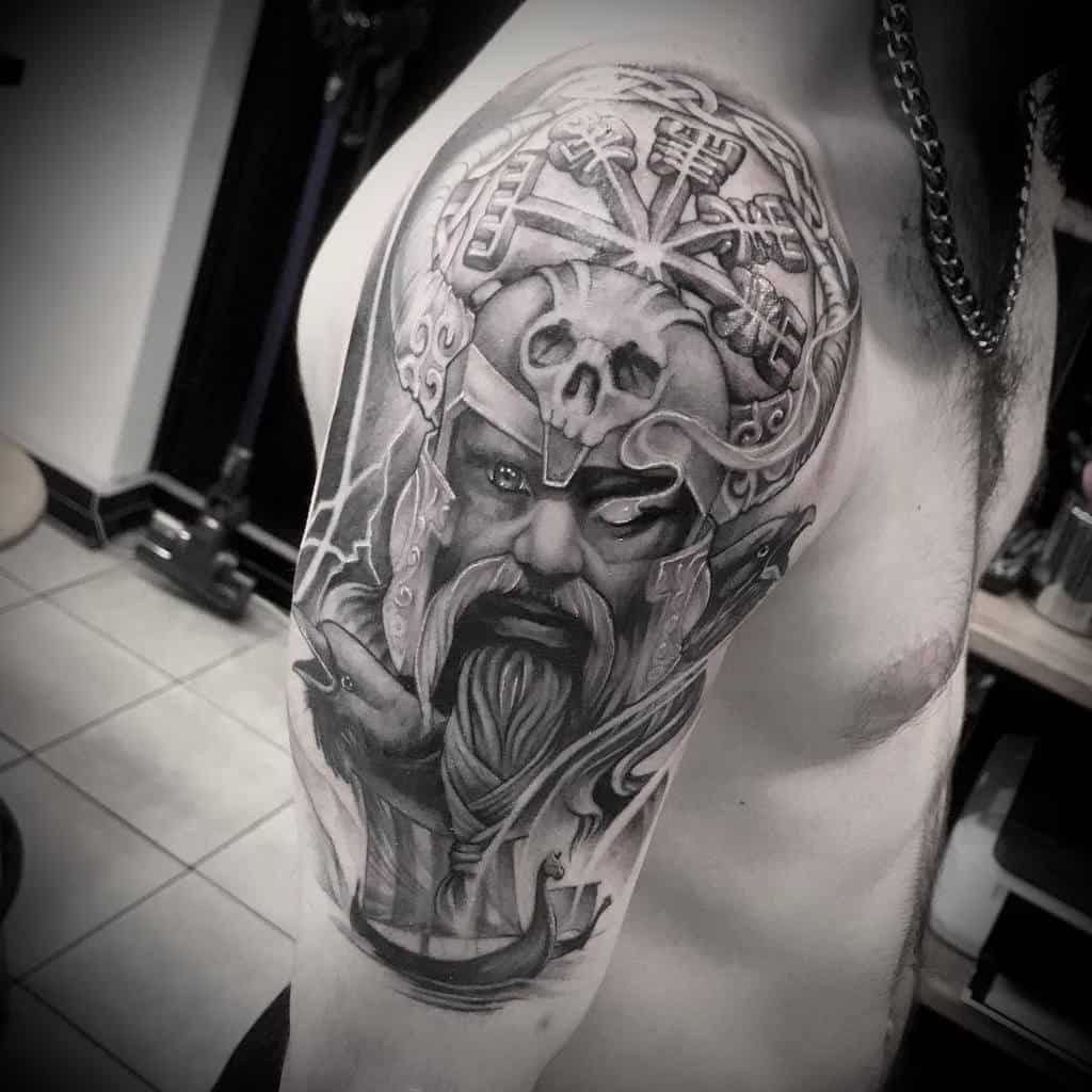 Nordic shoulder tattoo featuring a Viking warrior, intricate helmet details, Norse symbols, and a dramatic skull motif