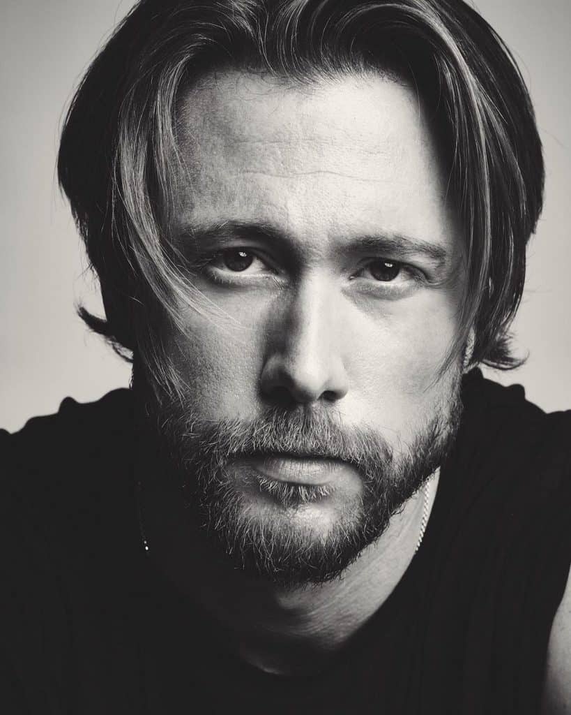 Off Center Parted Curtain Haircut for Men